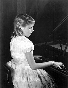 Sarah with harpsichord, age 10